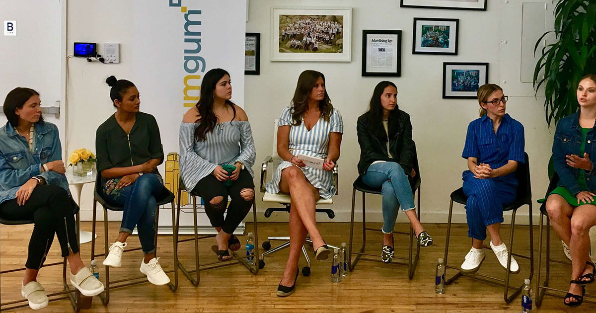 Photograph of seven women having a discussion